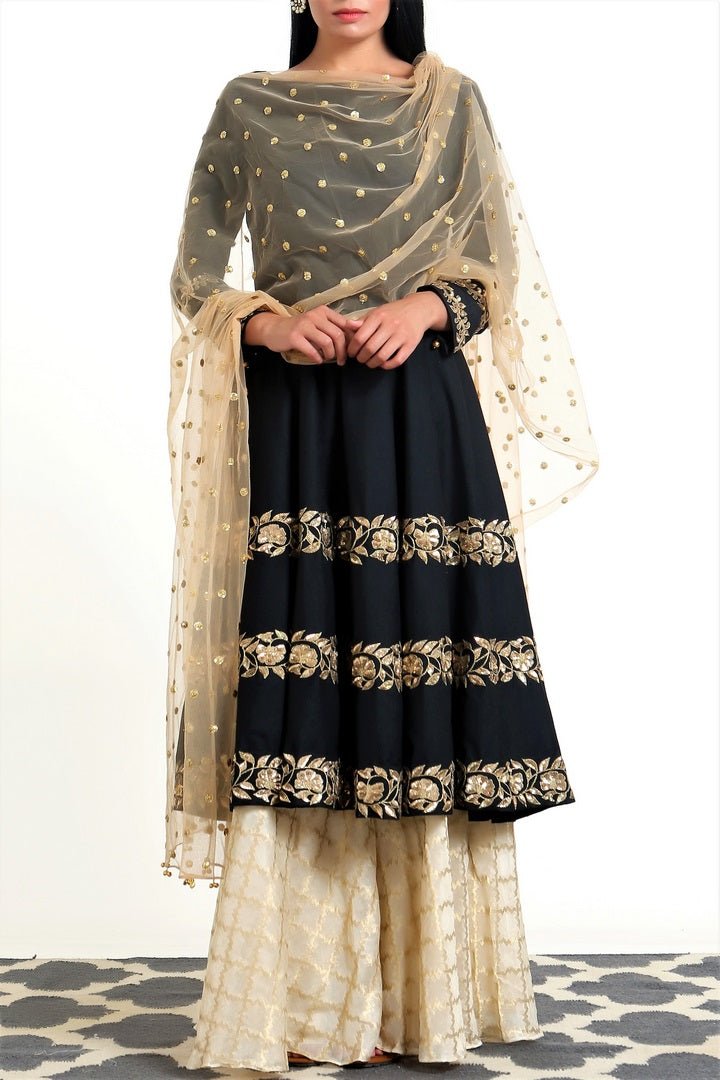 Buy black hand embroidered silk short kalidaar with palazzo online in USA. Get occasion ready with a stunning range of Indian designer suits from Pure Elegance fashion store in USA. We bring the best designer dresses for Indian women in USA at our online store. Shop now.-full view