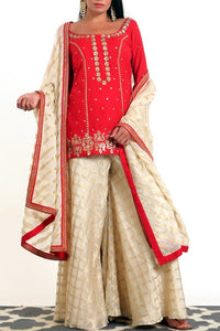 Buy crimson red silk blend short kurta with gold tissue net gharara online in USA. Get occasion ready with a stunning range of Indian designer suits from Pure Elegance fashion store in USA. We bring the best designer dresses for Indian women in USA at our online store. Shop now.-full view