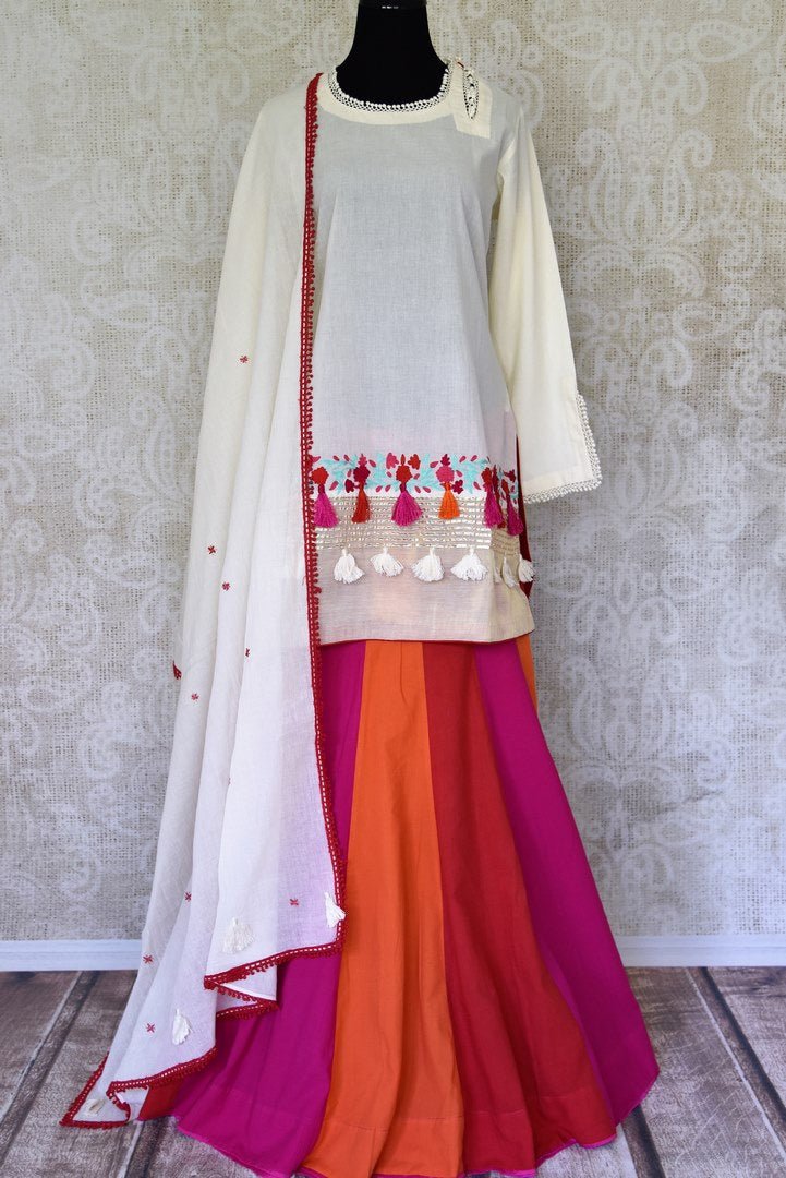 Buy cream color embroidered kurta with multicolor skirt and dupatta online in USA. Enhance your ethnic style on special occasions with a splendid range of Indian designer clothes for women available at Pure Elegance fashion store in USA.-full view