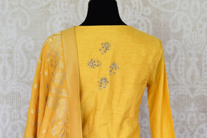 Shop mustard yellow embroidered floor length suit with dupatta online in USA. Enhance your ethnic style on special occasions with a splendid range of Indian designer clothes for women available at Pure Elegance fashion store in USA.-back