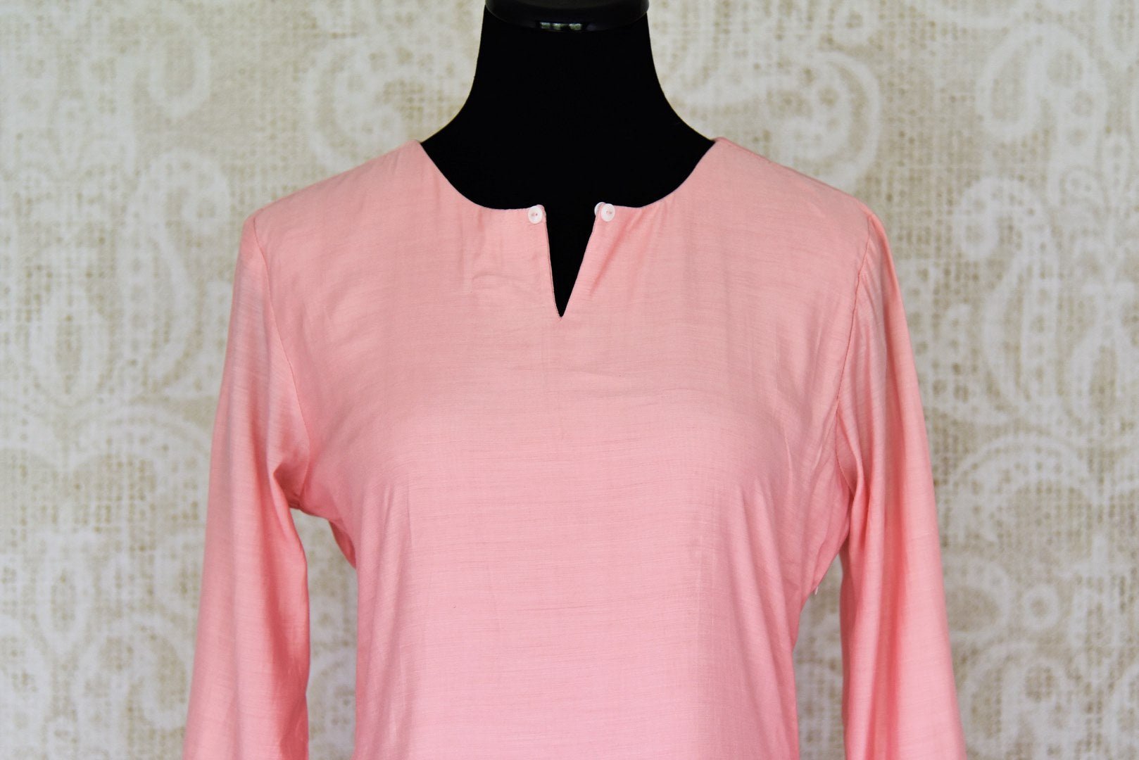 Shop baby pink asymmetric silk suit online in USA. Enhance your ethnic style on special occasions with a splendid range of Indian designer clothes for women available at Pure Elegance fashion store in USA.-front
