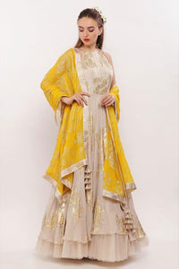 Buy beige gold printed embroidered Anarkali with yellow dupatta and churidaar online in USA. Pick your favorite Indian designer suits and dresses from Pure Elegance clothing store in USA. Ace your style game with a range of Indian saris, Anarkali suits, designer lehengas also available on our online store.  -full view