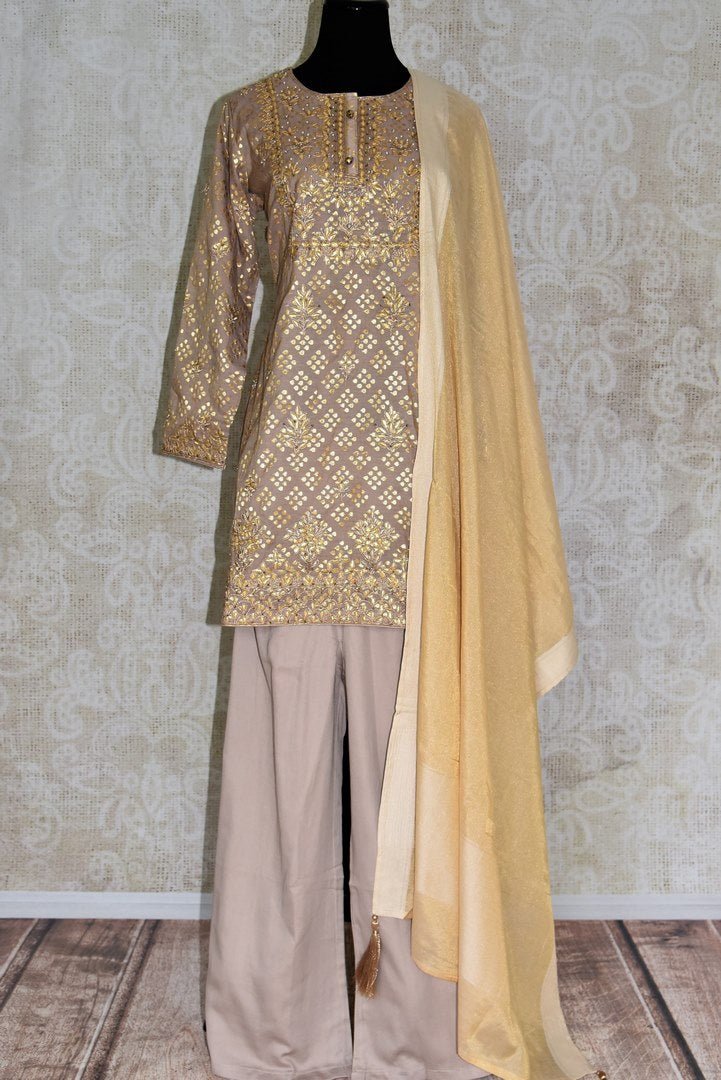 Buy beige color gota patti embroidery kurta with palazzo online in USA. Elevate your ethnic style with a range of captivating Indian designer clothing from Pure Elegance Indian clothing store in USA. Add designer suits, embroidered sarees, pure silk saris to your wardrobe for a beautiful look this festive season.-full view