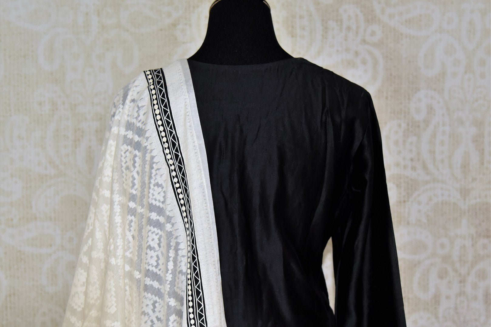 Buy black silk kurta with white palazzo online in USA and embroidered dupatta. Elevate your ethnic style with a range of captivating Indian designer clothes from Pure Elegance Indian clothing store in USA. Make the festive season bright with beautiful pure silk saris, Banarasi saris, designer suits from our online store.-back
