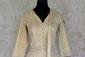 Buy beige color embroidered chanderi Anarkali with dupatta online in USA. Elevate your ethnic style with a range of captivating Indian designer clothing from Pure Elegance Indian clothing store in USA. Add designer suits, embroidered sarees, pure silk saris to your wardrobe for a beautiful look this festive season.-front