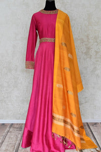 Buy pink embroidered silk floor length Anarkali suit online in USA with yellow dupatta. Shine bright on special occasions with traditional Indian dresses, designer lehengas, Anarkali suits in exquisite designs from Pure Elegance Indian fashion store in USA.-full view