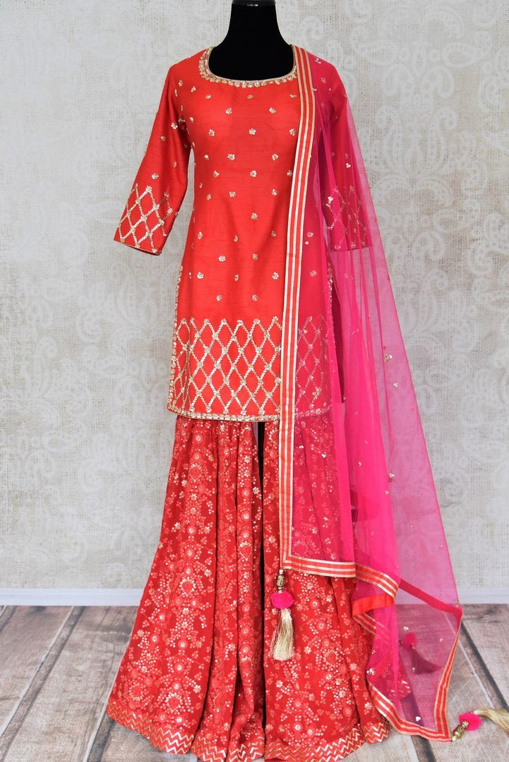 Shop red embroidered silk kurta with sharara online in USA with pink dupatta. Shine bright on special occasions with traditional Indian dresses, designer lehengas, Anarkali suits in exquisite designs from Pure Elegance Indian fashion store in USA.-full view
