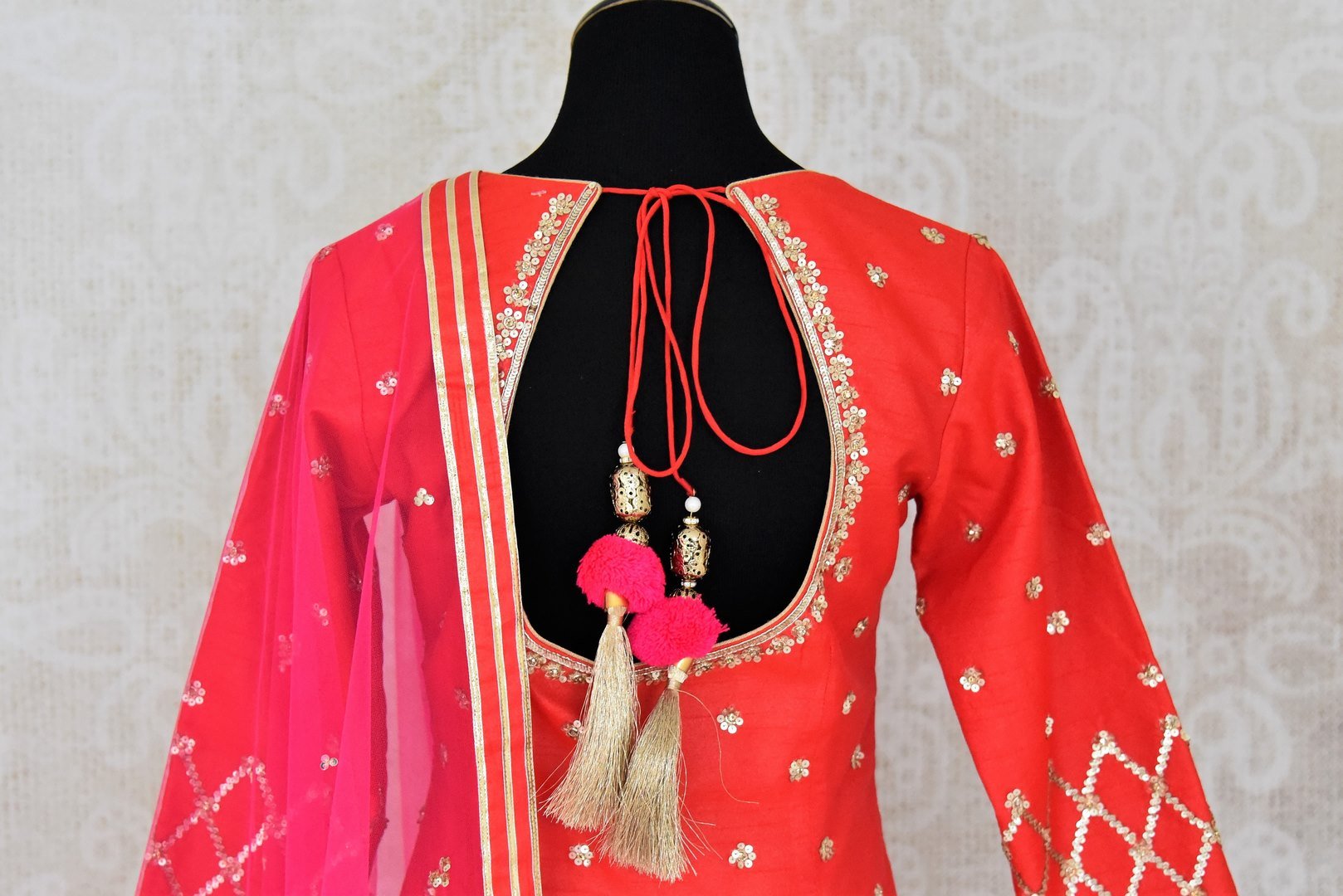 Shop red embroidered silk kurta with sharara online in USA with pink dupatta. Shine bright on special occasions with traditional Indian dresses, designer lehengas, Anarkali suits in exquisite designs from Pure Elegance Indian fashion store in USA.-back