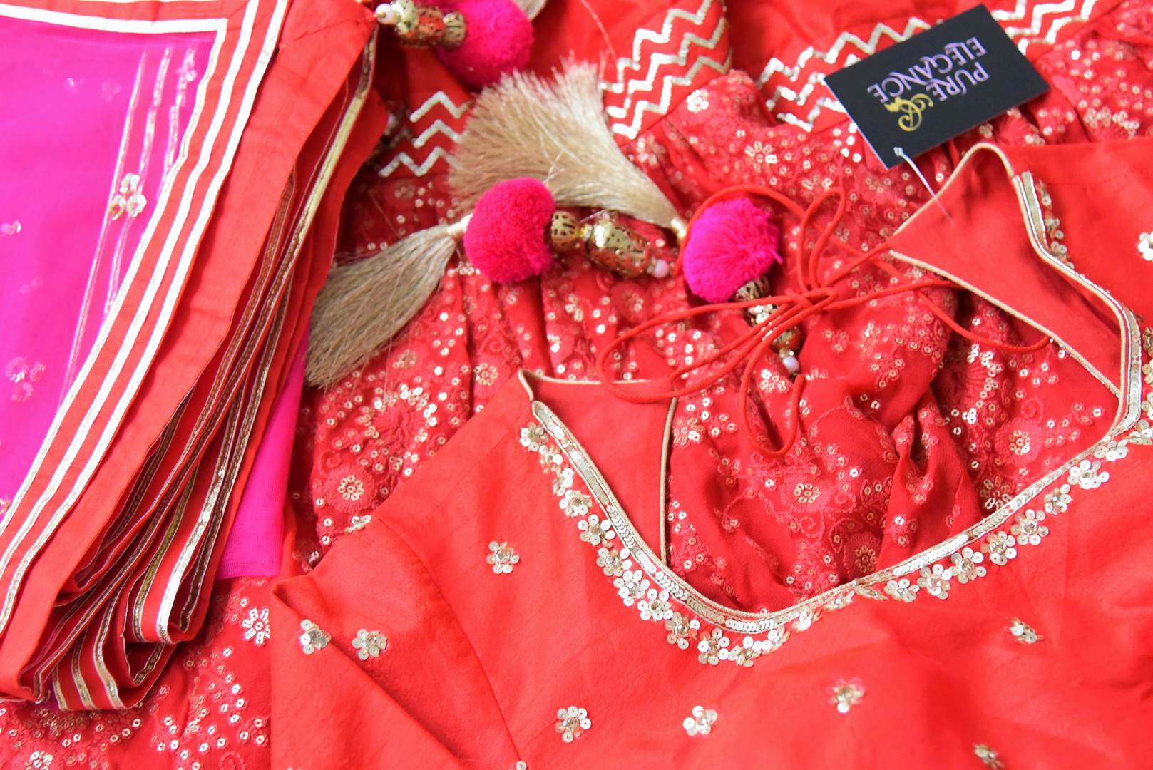 Shop red embroidered silk kurta with sharara online in USA with pink dupatta. Shine bright on special occasions with traditional Indian dresses, designer lehengas, Anarkali suits in exquisite designs from Pure Elegance Indian fashion store in USA.-details
