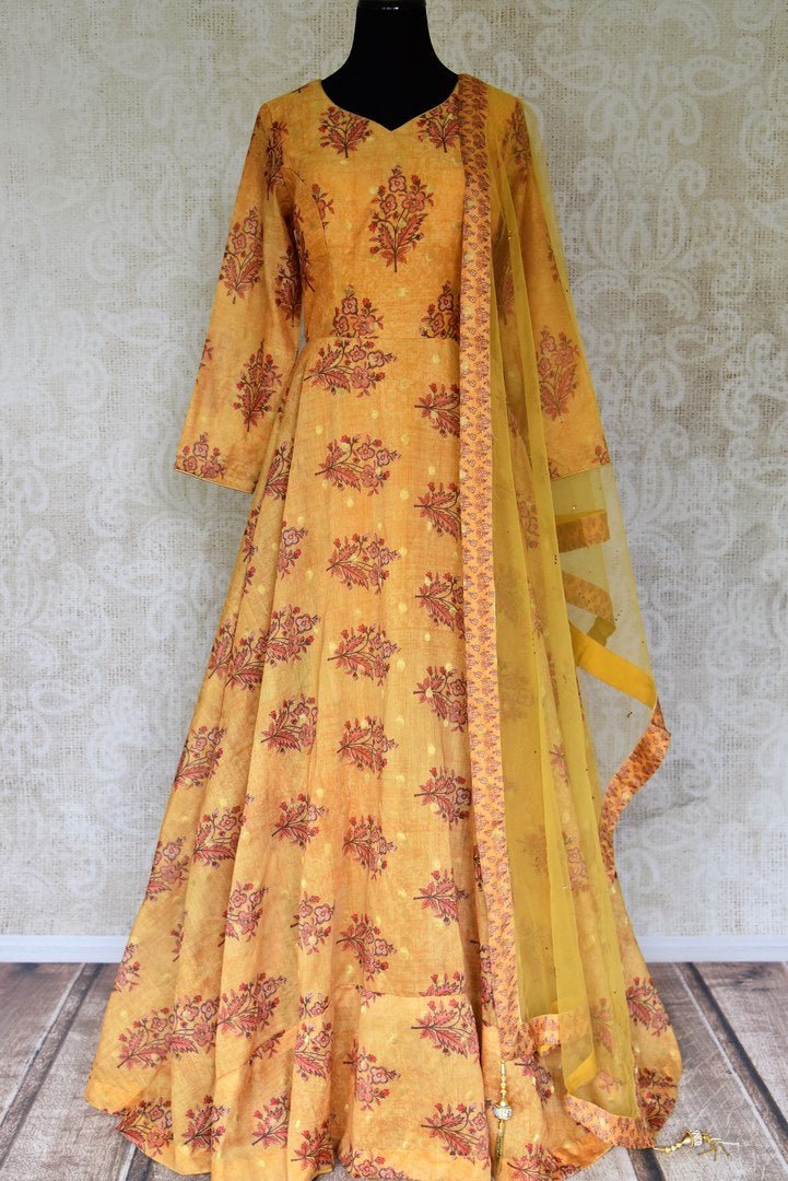 Buy mustard floral print silk floorlength Anarkali suit with dupatta online in USA. Shop more such Indian designer Anarkali suits, designer Indian dresses, wedding dresses in USA from Pure Elegance clothing fashion store this wedding season.-full view