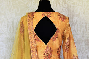 Buy mustard floral print silk floorlength Anarkali suit with dupatta online in USA. Shop more such Indian designer Anarkali suits, designer Indian dresses, wedding dresses in USA from Pure Elegance clothing fashion store this wedding season.-back