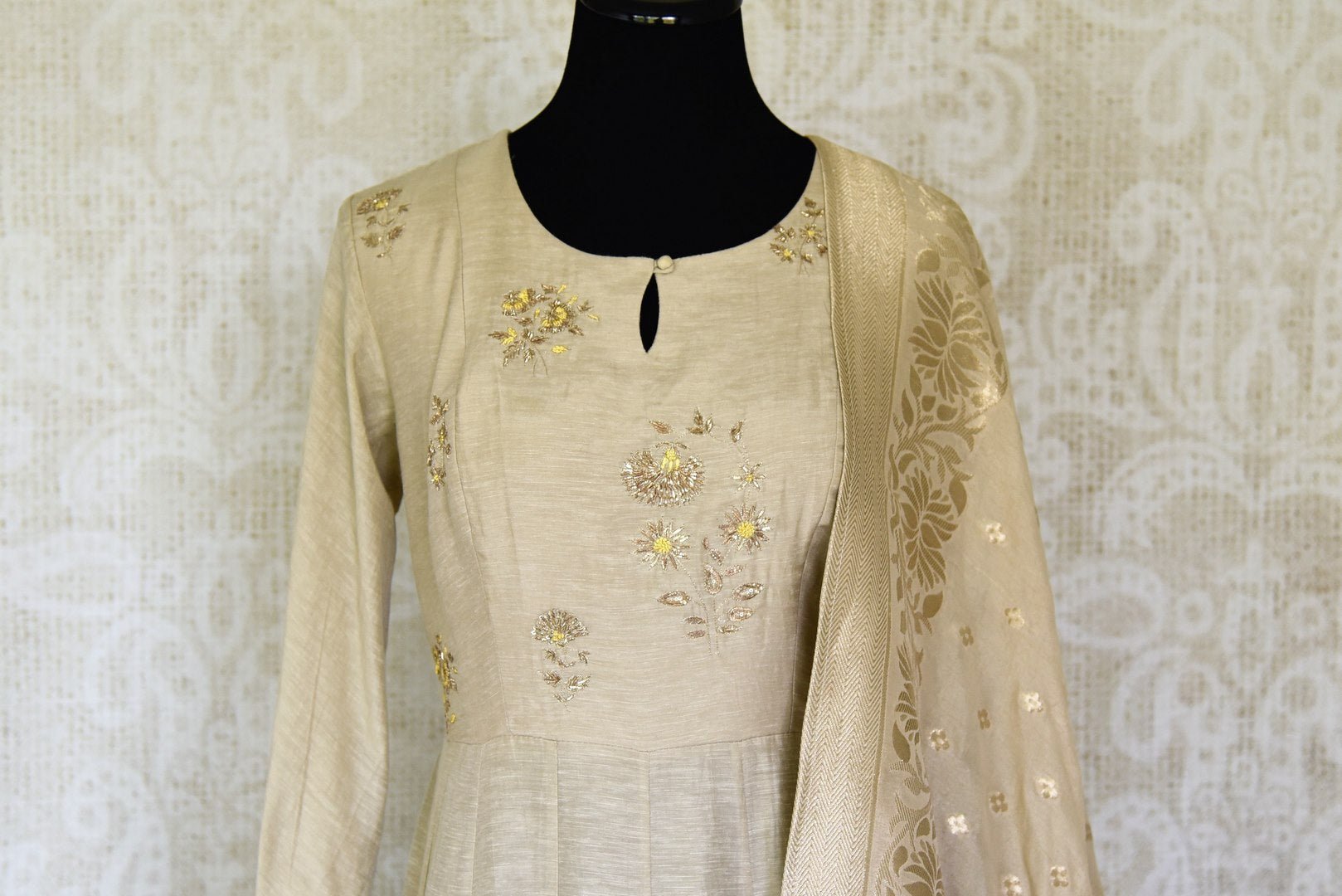 Shop stunning beige embroidered floorlength silk Anarkali suit with dupatta online in USA. Shop more such traditional Indian suits, designer wedding dresses, Anarkali suits in USA from Pure Elegance clothing fashion store this wedding season.-front
