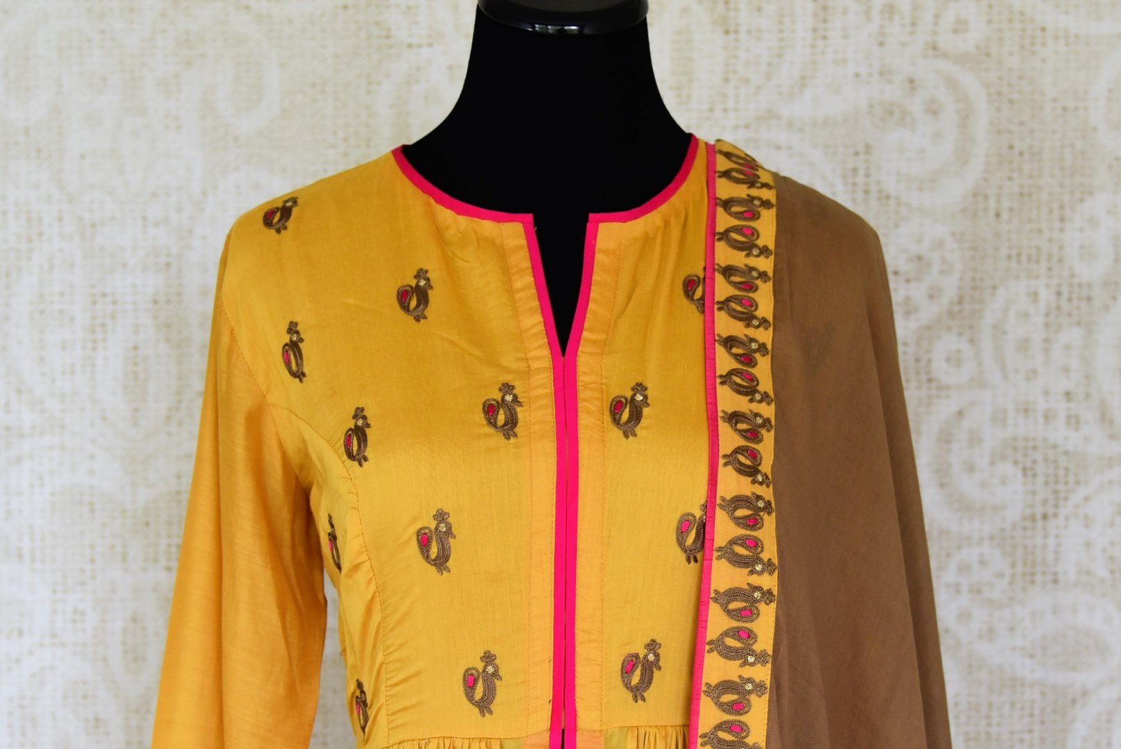 Buy mustard color embroidered silk floorlength Anarkali suit with brown dupatta online in USA. Shop more such Indian designer Anarkali suits, designer Indian dresses, wedding dresses in USA from Pure Elegance clothing fashion store this wedding season.-front