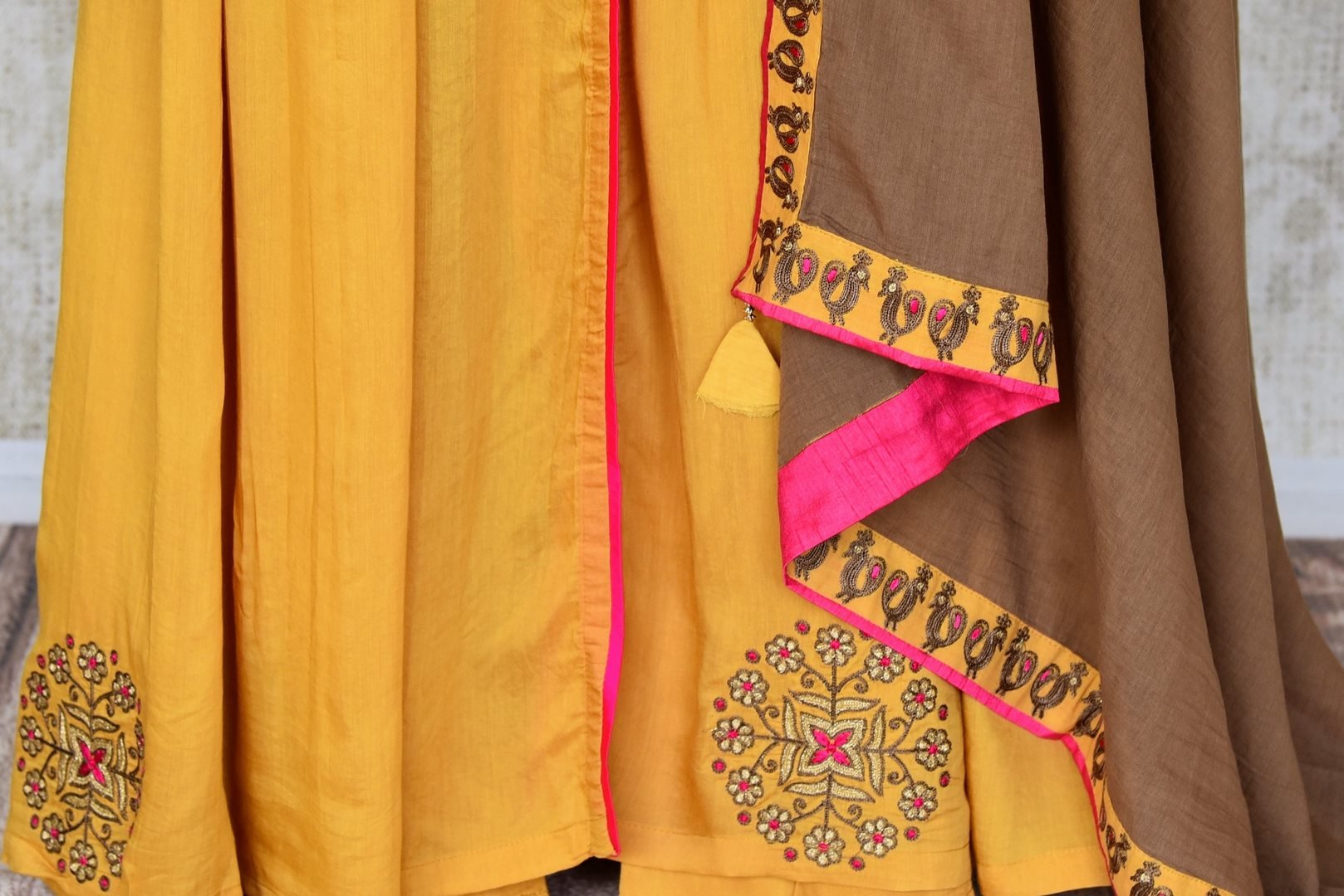 Buy mustard color embroidered silk floorlength Anarkali suit with brown dupatta online in USA. Shop more such Indian designer Anarkali suits, designer Indian dresses, wedding dresses in USA from Pure Elegance clothing fashion store this wedding season.-bottom