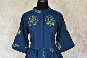 Buy blue embroidered silk peplum top with printed palazzo online in USA from Pure Elegance. Add exquisite Indian designer suits, Indian dresses, wedding lehengas in beautiful styles and designs to your ethnic wardrobe from our Indian clothing store in USA or shop online.-front