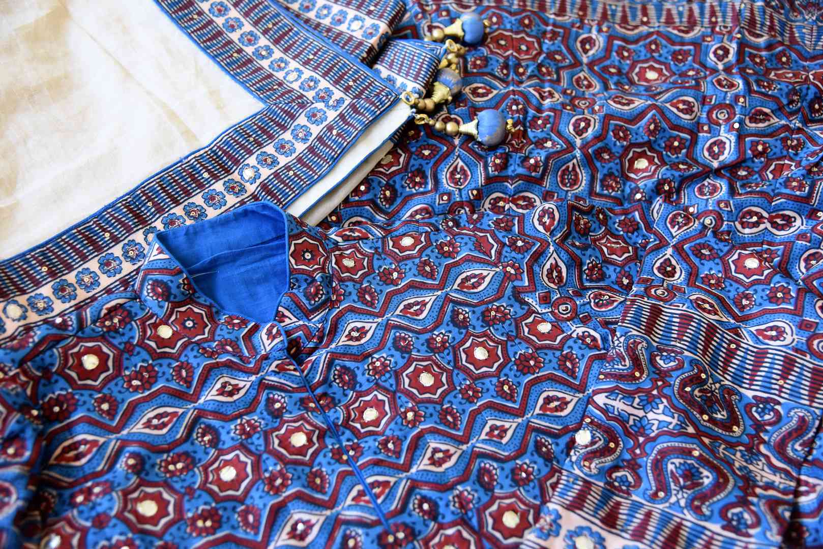 Buy blue Kalamkari print silk Anarkali suit online in USA with gota work. Make your party style absolutely special with beautiful Indian designer suits from Pure Elegance Indian fashion store in USA. Get floored with a range of beautiful Anarkali suits, designer lehengas, Indian dresses all under one roof for Indian women in USA.-details