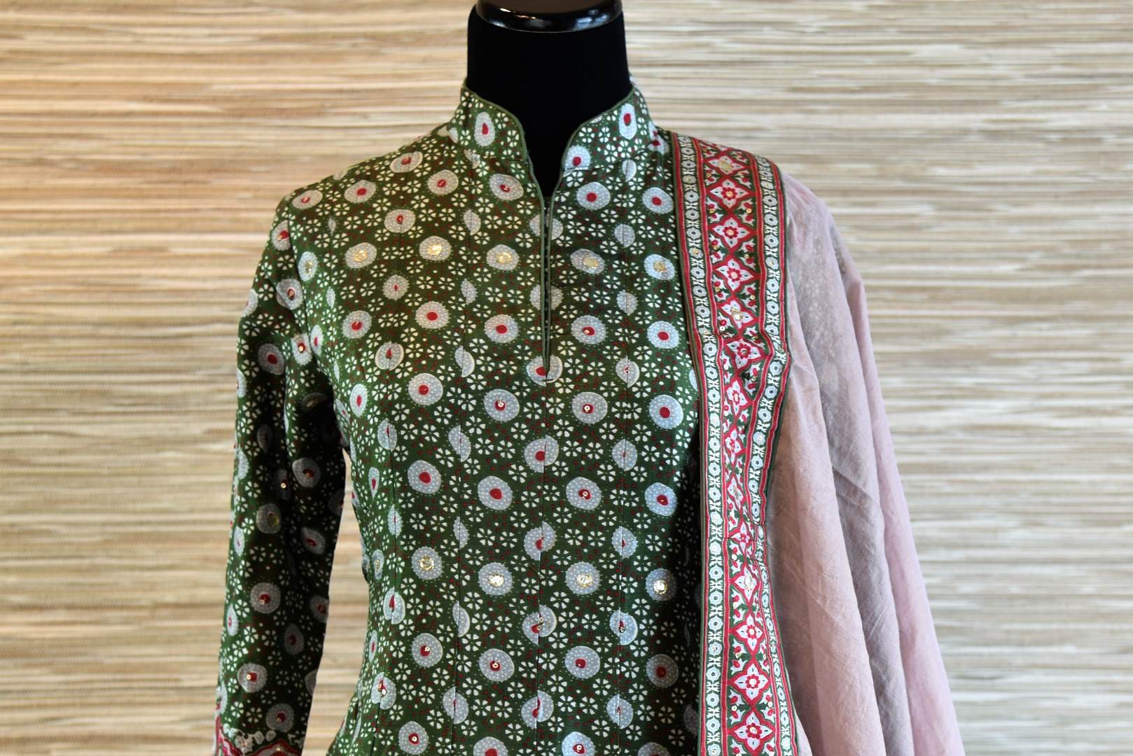 Shop dark green chanderi silk patola print Anarkali suit online in USA with dupatta. Be the talk of every occasion with exquisite Indian designer suits from Pure Elegance Indian clothing store in USA. -front