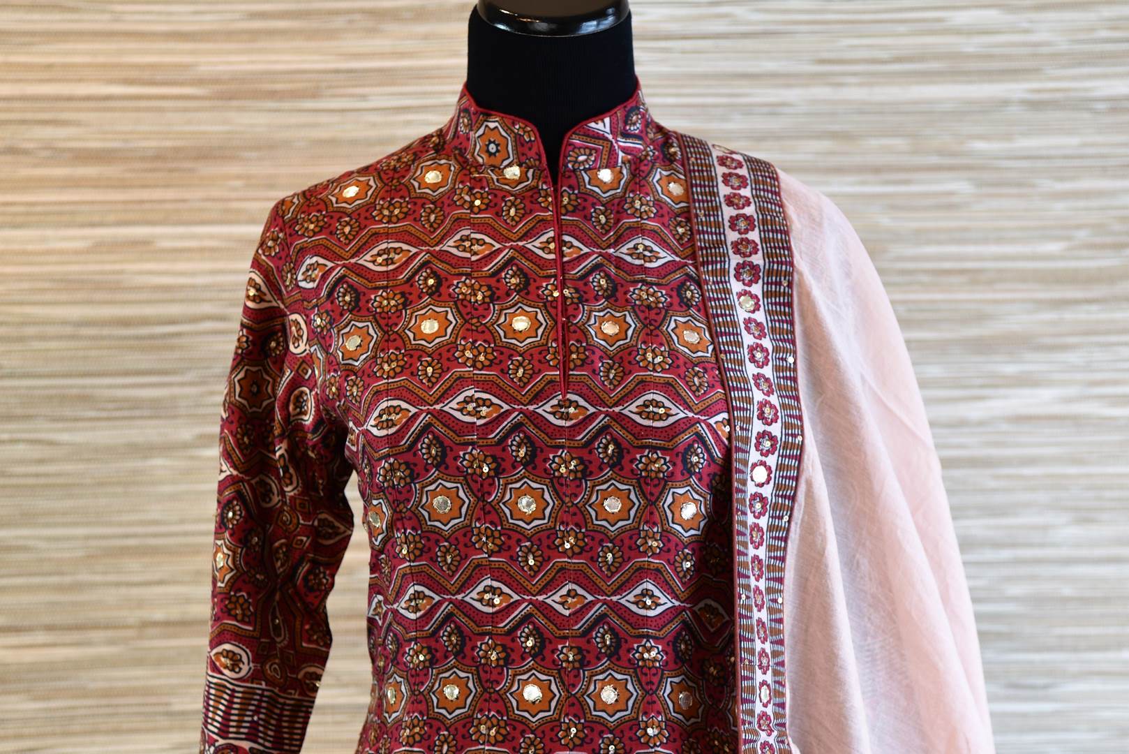 Buy maroon chanderi silk patola print Anarkali suit online in USA with dupatta. Be the talk of every occasion with exquisite Indian designer suits from Pure Elegance Indian clothing store in USA. -front