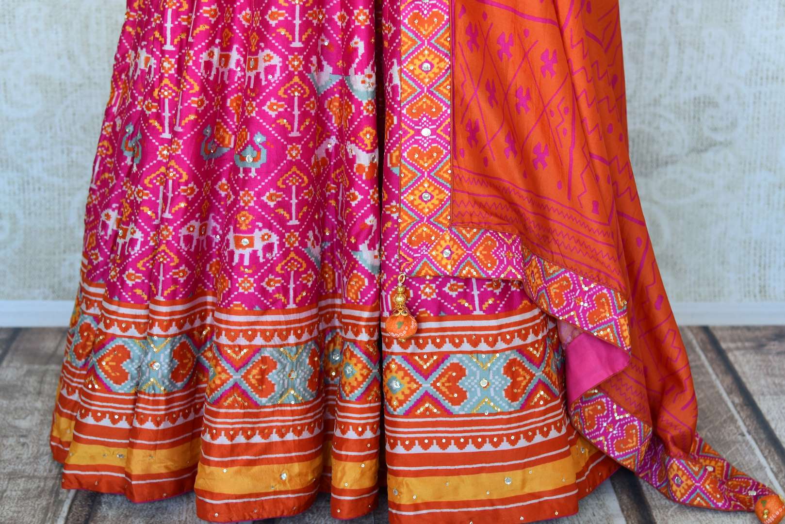 Shop pink ikat silk Anarkali suit online in USA with handwork and dupatta. Make your party style absolutely special with beautiful Indian designer suits from Pure Elegance Indian fashion store in USA. Get floored with a range of beautiful Anarkali suits, designer lehengas, Indian dresses all under one roof for Indian women in USA.-bottom