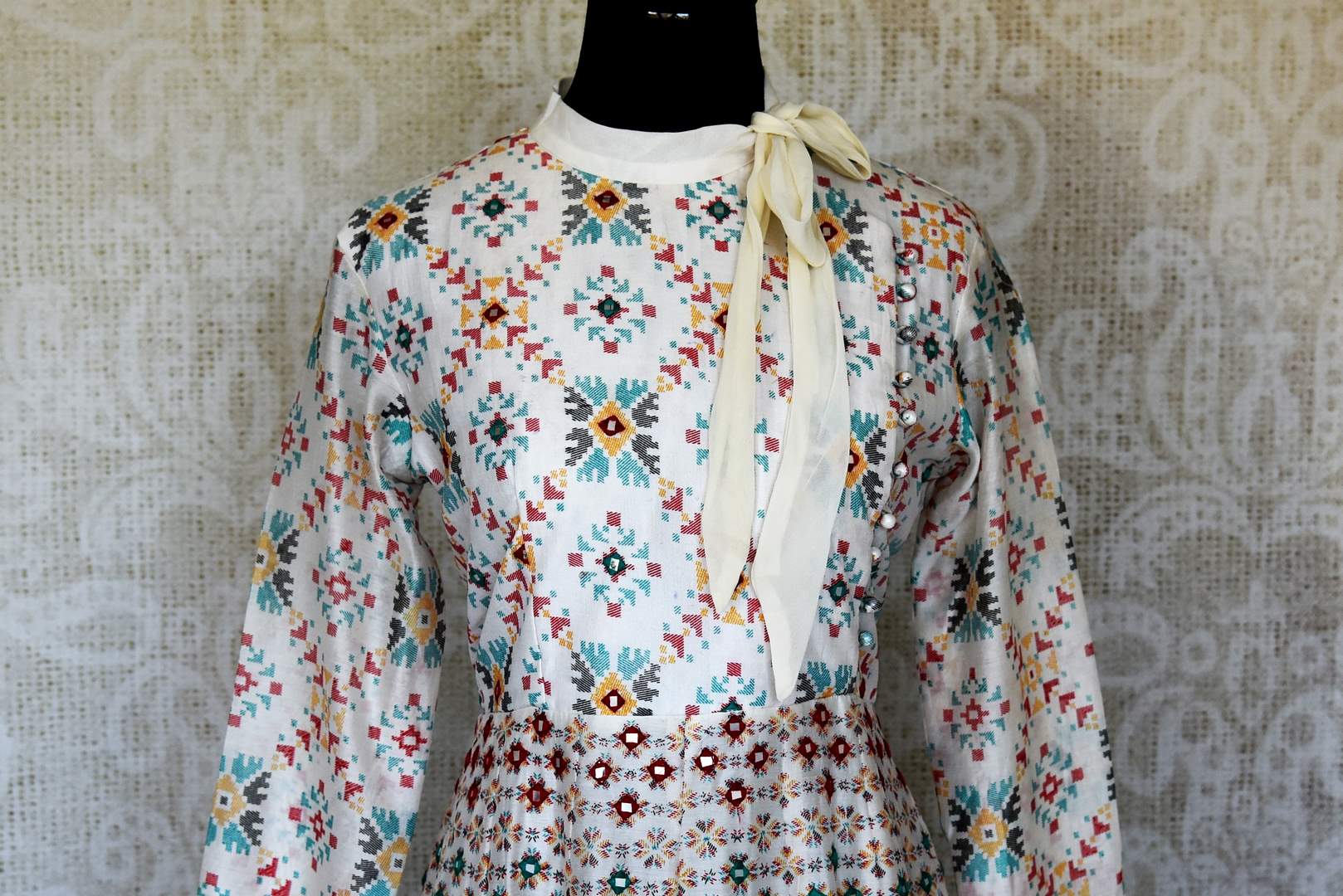 Shop elegant white silk Anarkali dress online in USA with mirror work. Make your party style absolutely special with beautiful Indian designer suits from Pure Elegance Indian fashion store in USA. Get floored with a range of beautiful Anarkali suits, designer lehengas, Indian dresses all under one roof for Indian women in USA.-front