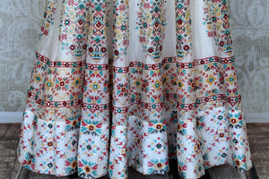 Shop elegant white silk Anarkali dress online in USA with mirror work. Make your party style absolutely special with beautiful Indian designer suits from Pure Elegance Indian fashion store in USA. Get floored with a range of beautiful Anarkali suits, designer lehengas, Indian dresses all under one roof for Indian women in USA.-bottom