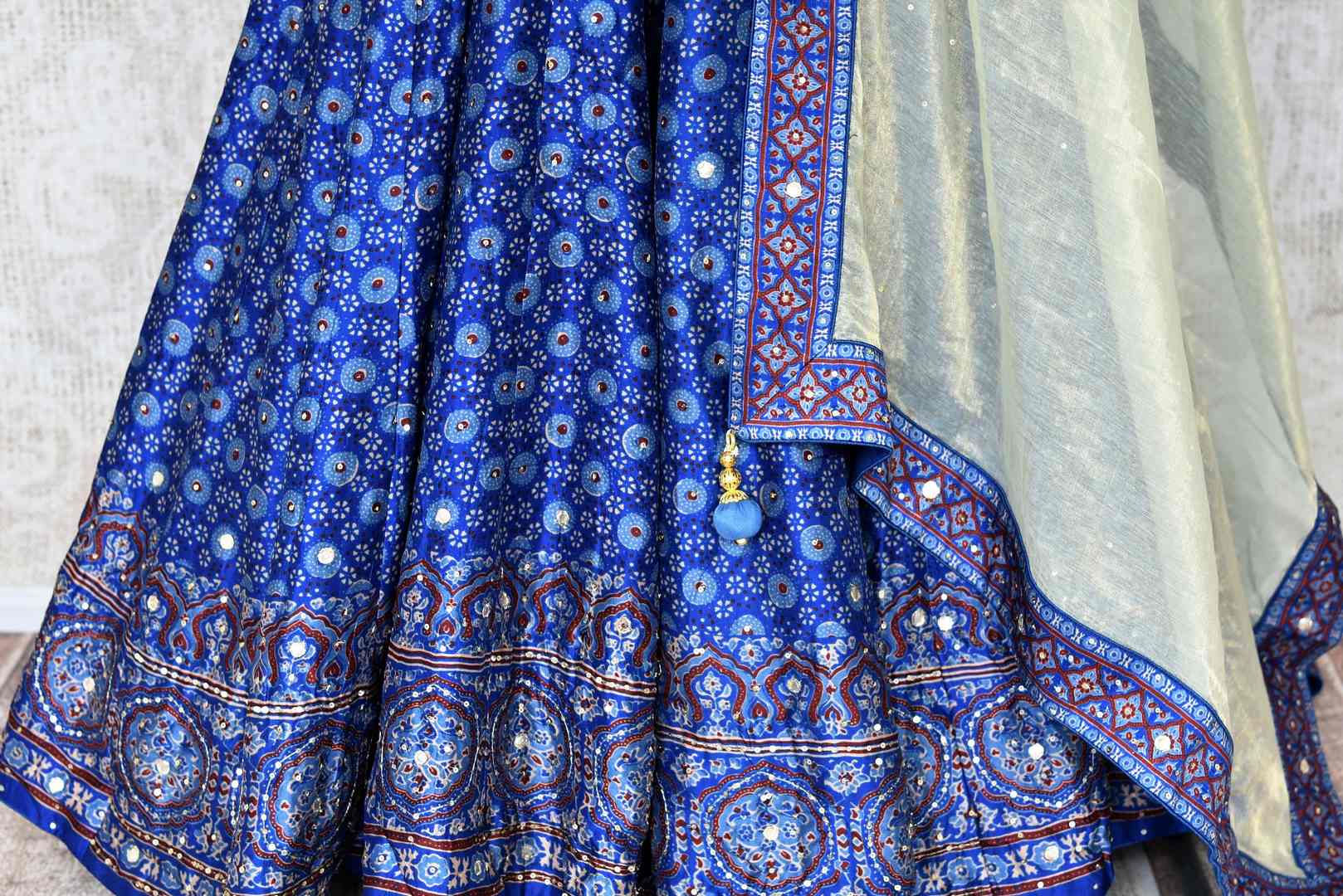 Buy blue Kalamkari print hand embroidered silk Anarkali online in USA. Be the talk of weddings and special occasions with a splendid collection of Indian designer suits from Pure Elegance Indian clothing store in USA. We have a spectacular range of designer dresses, bridal lehengas for Indian brides in USA.-bottom