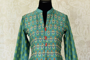 Buy green printed silk Anarkali dress online in USA with frilled sleeves. Be the talk of weddings and special occasions with a splendid collection of Indian designer suits from Pure Elegance Indian clothing store in USA. We have a spectacular range of designer dresses, bridal lehengas for Indian brides in USA.-front