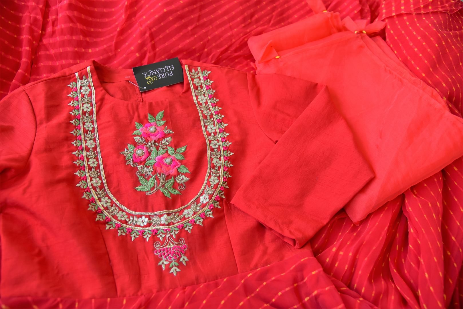 Shop red silk georgette embroidered Anarkali suit online in USA. Be the talk of weddings and special occasions with a splendid collection of Indian designer suits from Pure Elegance Indian clothing store in USA. We have a spectacular range of designer dresses, designer lehengas for Indian women in USA.-details