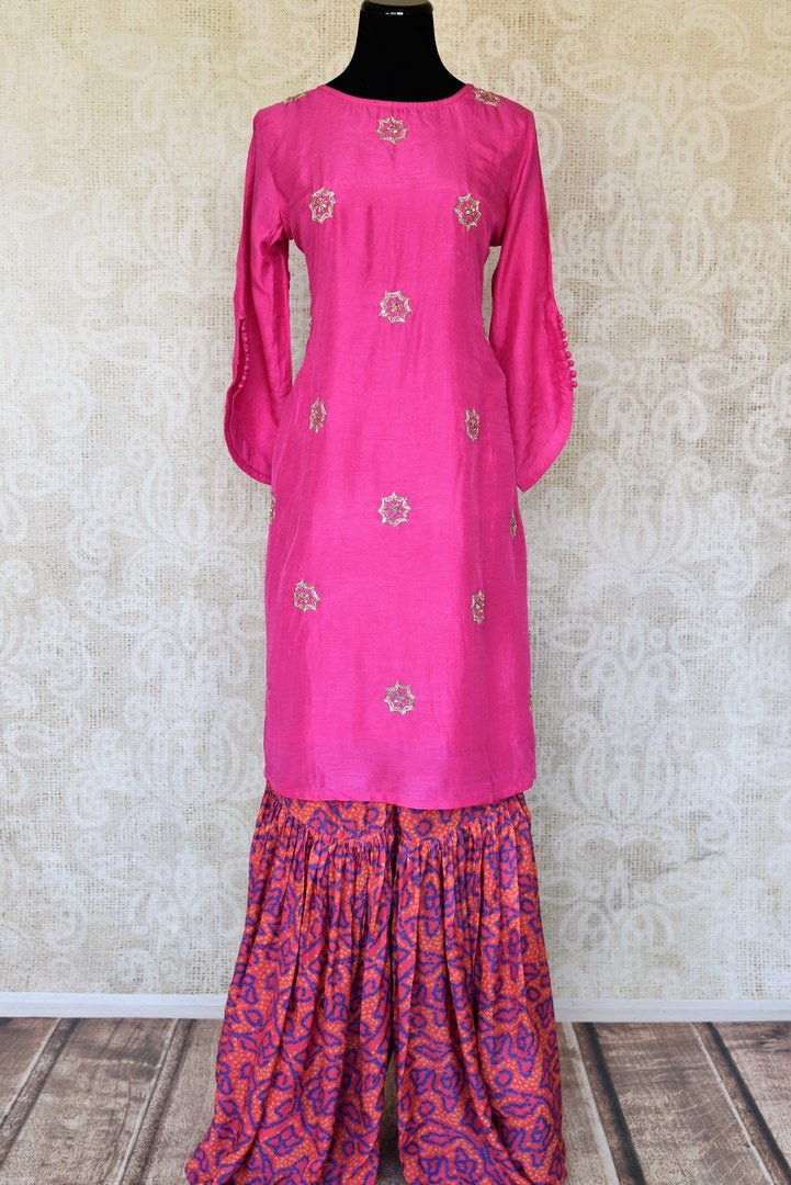 Buy fuschia pink embroidered silk top with Bandhej palazzo online in USA. Be the talk of weddings and special occasions with a splendid collection of Indian designer suits from Pure Elegance Indian clothing store in USA. We have a spectacular range of designer dresses, designer lehengas for Indian women in USA.-full view