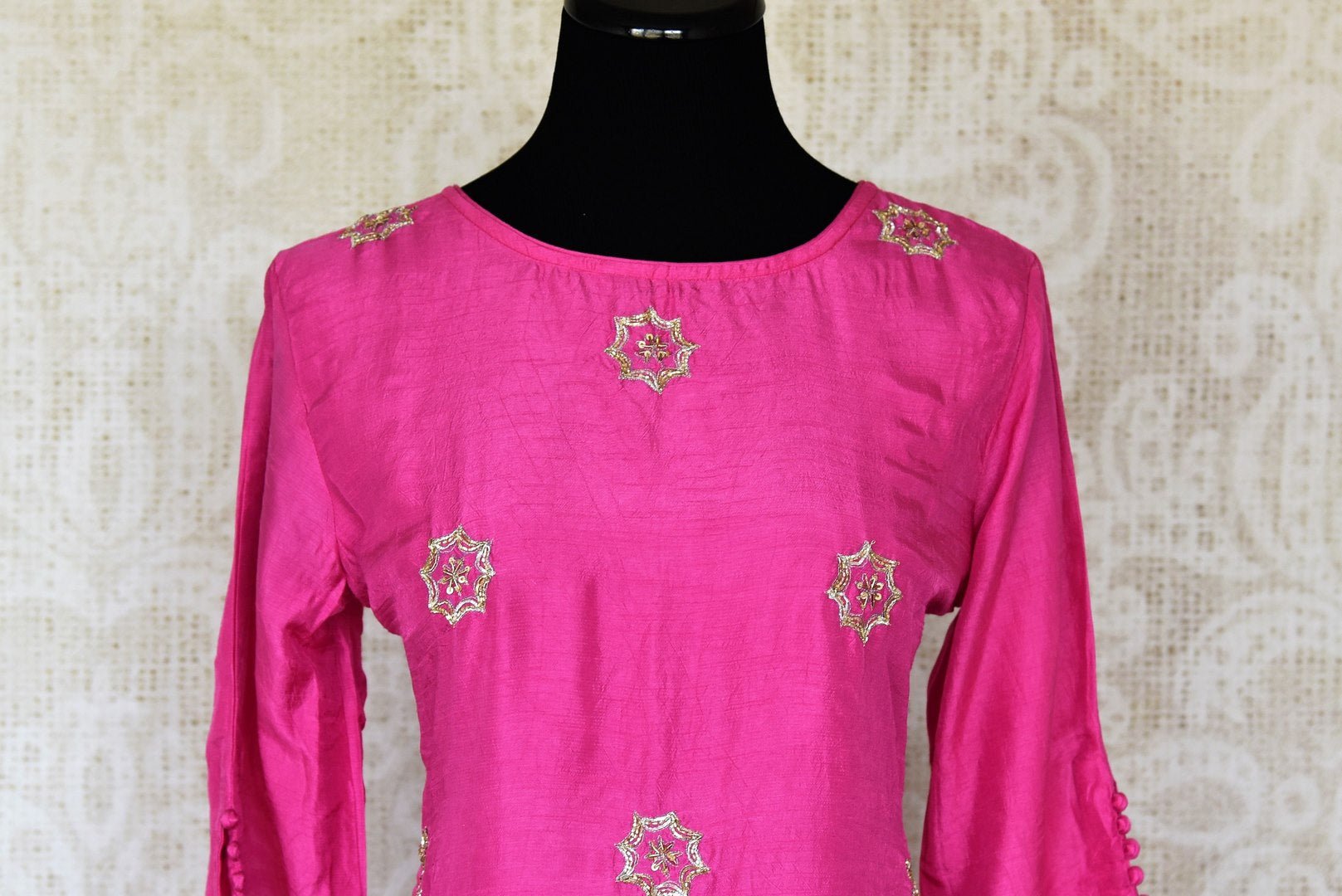 Buy fuschia pink embroidered silk top with Bandhej palazzo online in USA. Be the talk of weddings and special occasions with a splendid collection of Indian designer suits from Pure Elegance Indian clothing store in USA. We have a spectacular range of designer dresses, designer lehengas for Indian women in USA.-front
