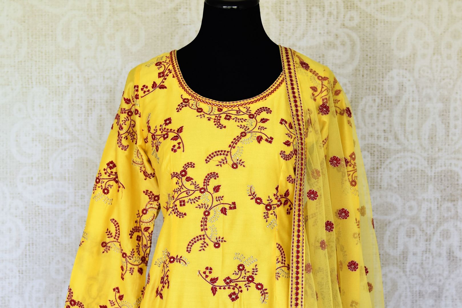 Buy yellow embroidered silk sharara suit online in USA with dupatta. Make special occasions even more special with your captivating traditional style in designer salwar suits from Pure Elegance Indian clothing in USA.-front