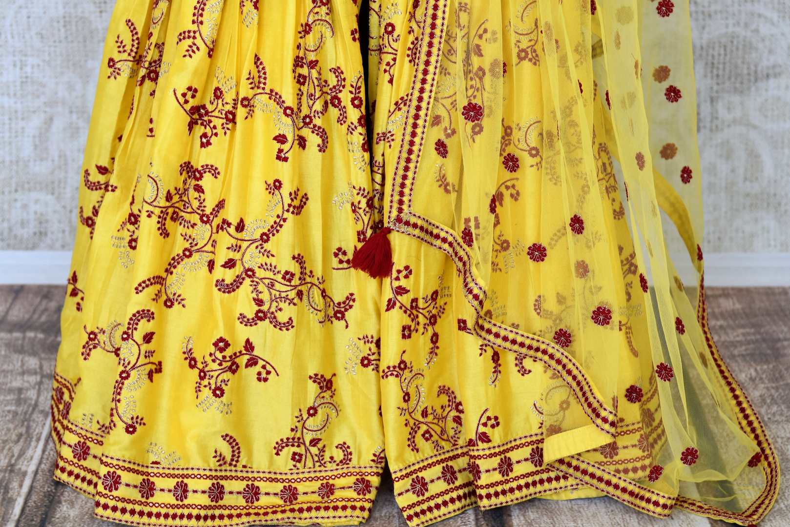 Buy yellow embroidered silk sharara suit online in USA with dupatta. Make special occasions even more special with your captivating traditional style in designer salwar suits from Pure Elegance Indian clothing in USA.-details