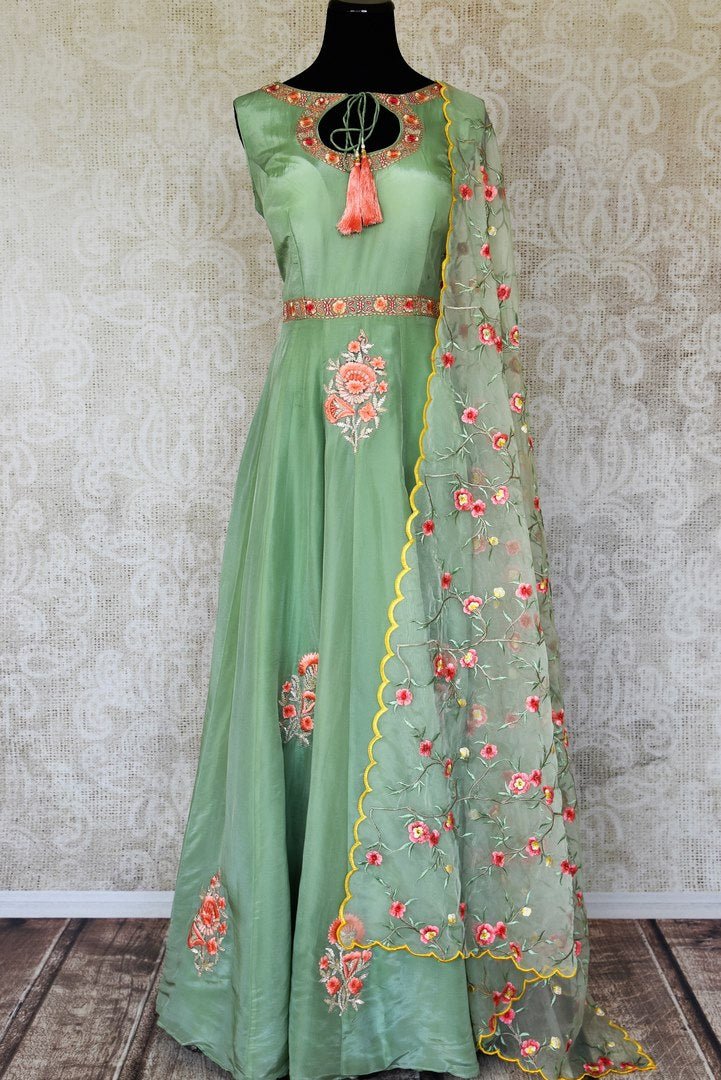 Shop green embroidered sleeveless silk Anarkali online in USA with dupatta. Pick your favorite Indian clothing from a colorful collection available at Pure Elegance Indian fashion store in USA. We have an alluring range of wedding lehengas, designer Anarkali suits, gowns for Indian women in USA.-full view