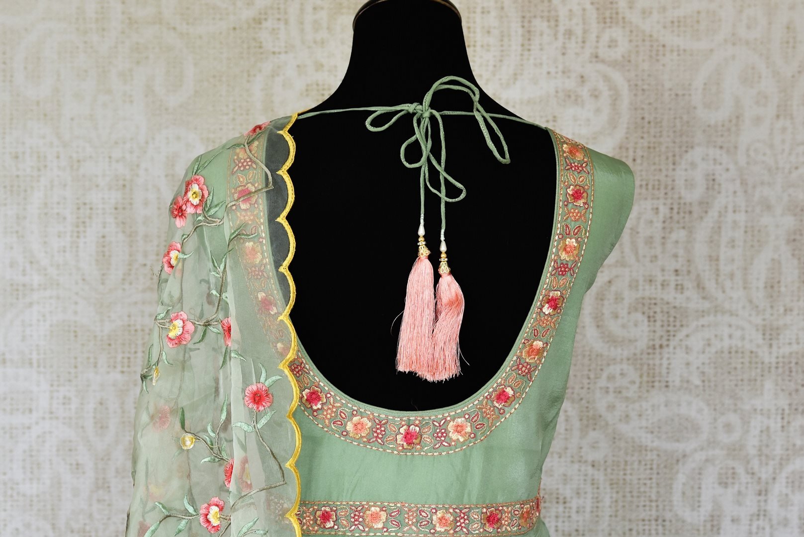 Shop green embroidered sleeveless silk Anarkali online in USA with dupatta. Pick your favorite Indian clothing from a colorful collection available at Pure Elegance Indian fashion store in USA. We have an alluring range of wedding lehengas, designer Anarkali suits, gowns for Indian women in USA.-back