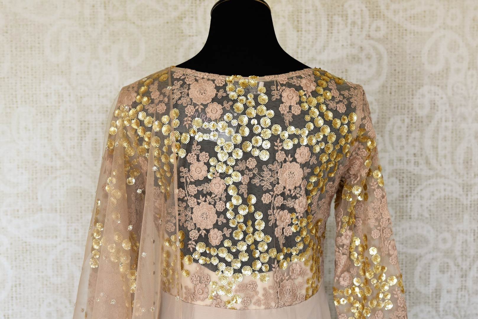 Buy dusty pink embroidered georgette net Anarkali suit online in USA with dupatta. Make fashionable choices with latest Indian designer clothing from Pure Elegance Indian fashion store in USA. Shop Indian salwar suits, designer Anarkali suits and bridal lehengas for Indian brides in USA from our online store.-back