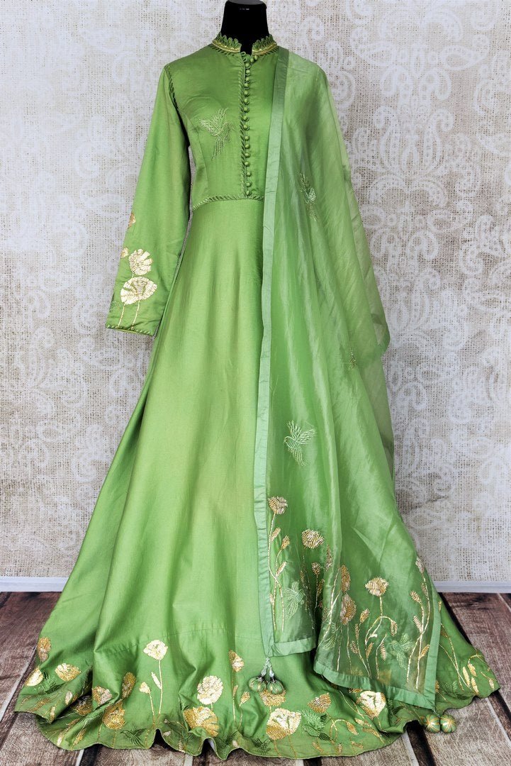 Green embroidered floorlength silk Anarkali for online shopping in USA with dupatta. Get floored by a vibrant collection of Indian designer clothes at Pure Elegance Indian fashion store in USA. Choose from a beautiful range of Indian wedding dresses, designer lehengas and suits for special occasions.-full view