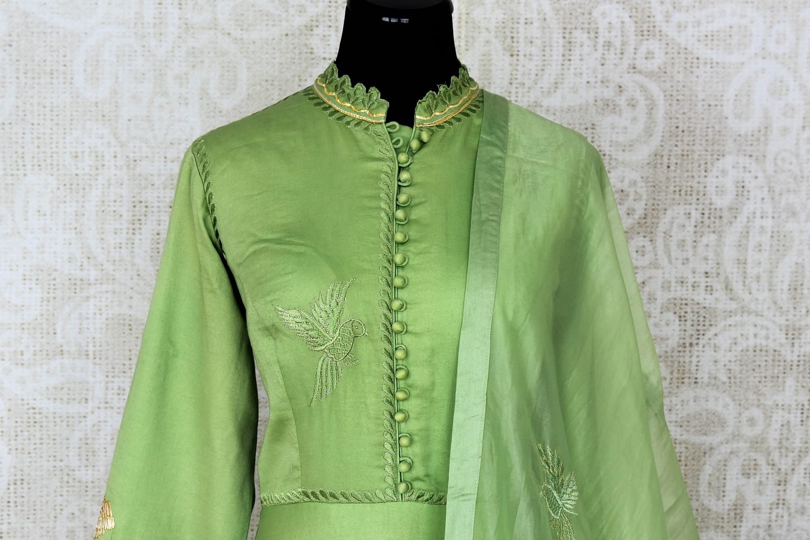 Green embroidered floorlength silk Anarkali for online shopping in USA with dupatta. Get floored by a vibrant collection of Indian designer clothes at Pure Elegance Indian fashion store in USA. Choose from a beautiful range of Indian wedding dresses, designer lehengas and suits for special occasions.-front