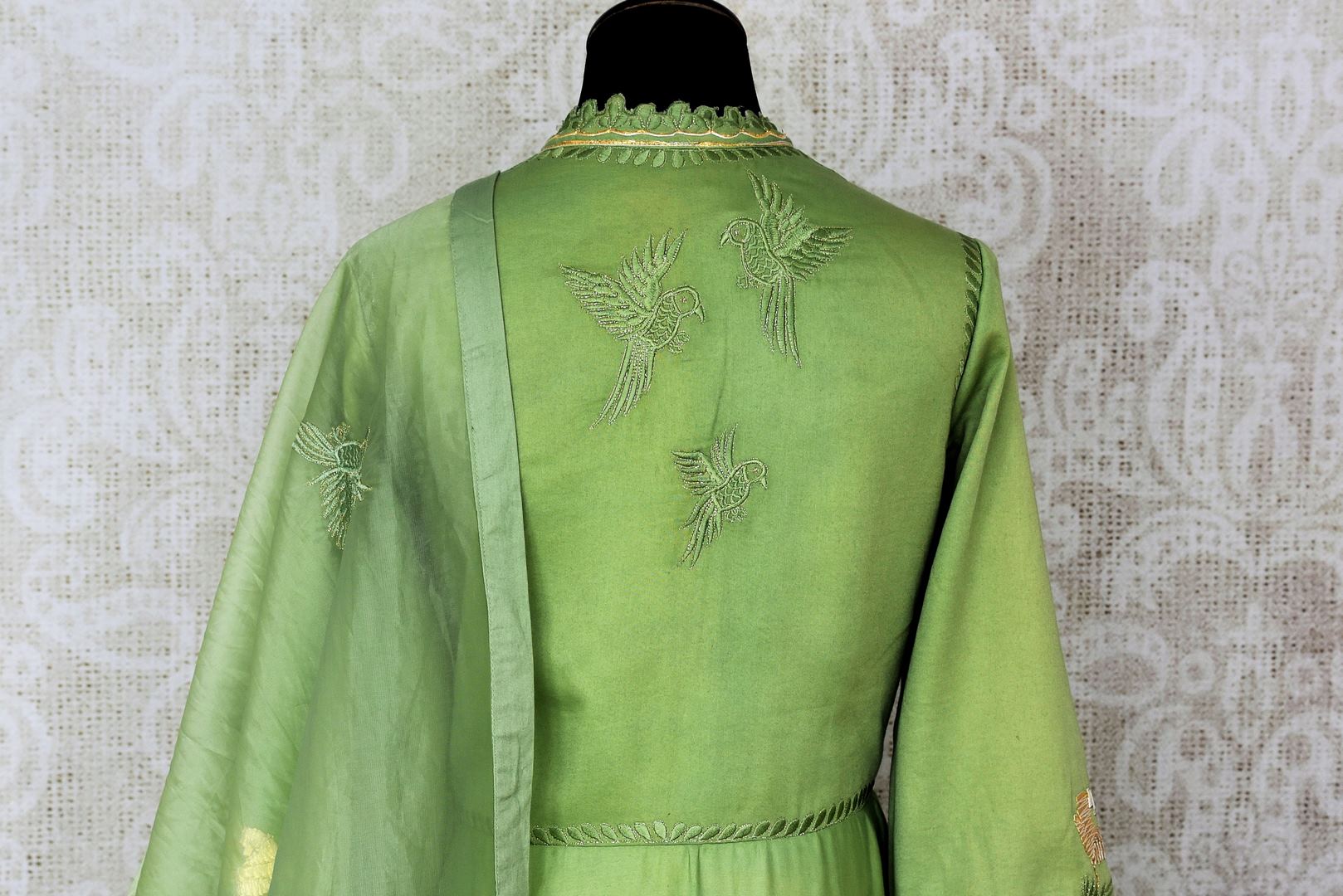 Green embroidered floorlength silk Anarkali for online shopping in USA with dupatta. Get floored by a vibrant collection of Indian designer clothes at Pure Elegance Indian fashion store in USA. Choose from a beautiful range of Indian wedding dresses, designer lehengas and suits for special occasions.-back