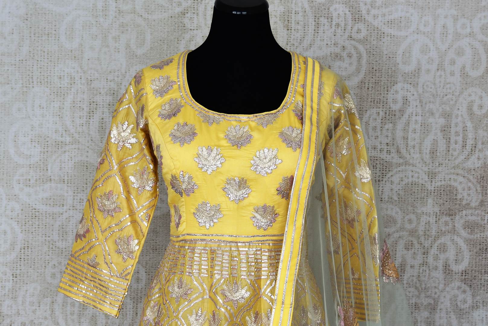 Lemon yellow gota work floorlength silk Anarkali for online shopping in USA with dupatta. Get floored by a vibrant collection of Indian designer clothes at Pure Elegance Indian fashion store in USA. Choose from a beautiful range of Indian wedding dresses, designer lehengas and suits for special occasions.-front
