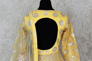 Lemon yellow gota work floorlength silk Anarkali for online shopping in USA with dupatta. Get floored by a vibrant collection of Indian designer clothes at Pure Elegance Indian fashion store in USA. Choose from a beautiful range of Indian wedding dresses, designer lehengas and suits for special occasions.-back