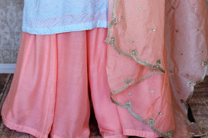 Shop sky blue and pink palazzo suit online in USA with badla work and dupatta. Make fashionable choices with latest Indian designer clothing from Pure Elegance Indian fashion store in USA. Shop Indian salwar suits, designer Anarkali suits and bridal lehengas for Indian brides in USA from our online store.-palazzo