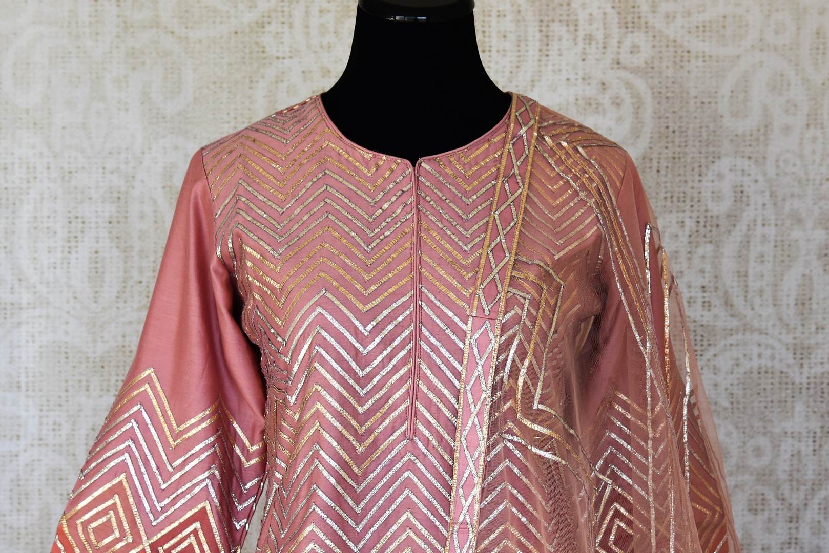 Shop soft pink gota pink silk kurta skirt set online in USA with dupatta. Keep your wardrobe update with latest Indian clothing from Pure Elegance Indian fashion store in USA. Shop beautiful Indian designer lehengas, Anarkali suits, gowns for Indian women in USA from our online store.-front