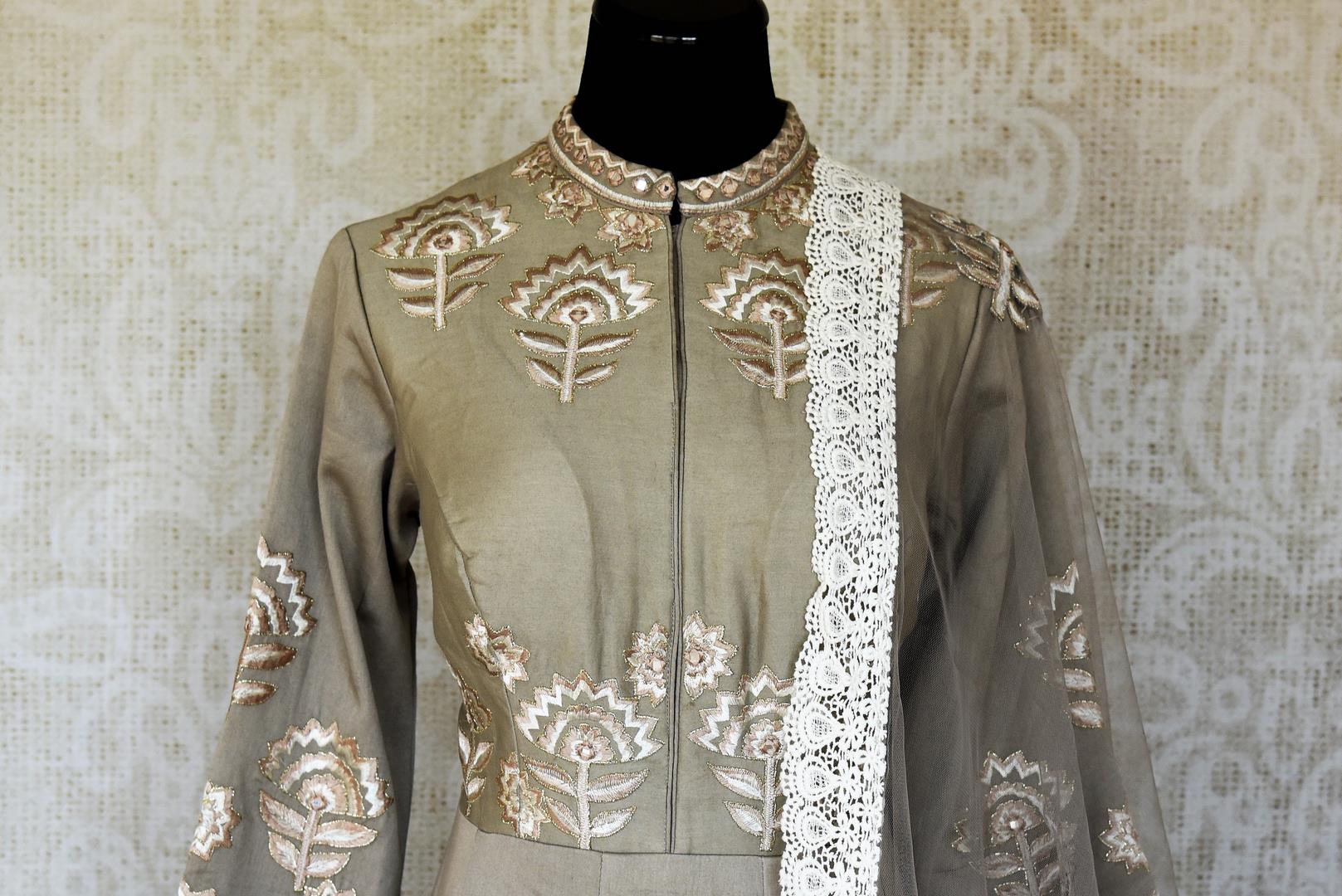 Buy grey silk embroidered floorlength Anarkali suit online in USA with dupatta. Keep your wardrobe update with latest Indian clothing from Pure Elegance Indian fashion store in USA. Shop beautiful Indian designer lehengas, Anarkali suits, gowns for Indian women in USA from our online store.-front