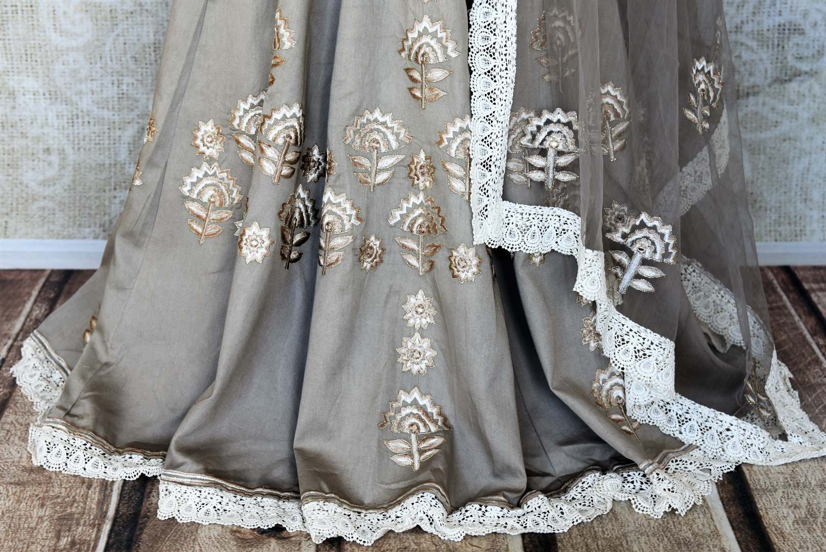 Buy grey silk embroidered floorlength Anarkali suit online in USA with dupatta. Keep your wardrobe update with latest Indian clothing from Pure Elegance Indian fashion store in USA. Shop beautiful Indian designer lehengas, Anarkali suits, gowns for Indian women in USA from our online store.-bottom