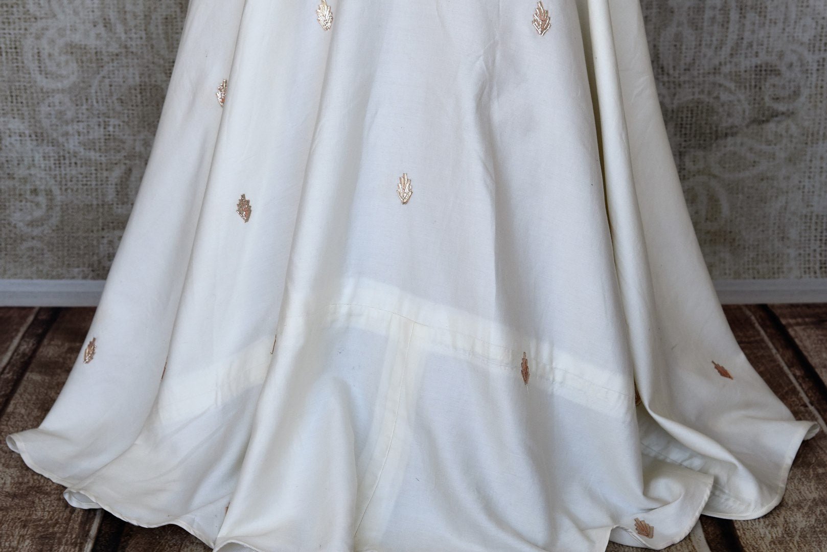 Shop cream embroidered silk designer gown online in USA. Make fashionable choices with latest Indian designer clothing from Pure Elegance Indian fashion store in USA. Shop Indian salwar suits, designer Anarkali suits and bridal lehengas for Indian brides in USA from our online store.-bottom