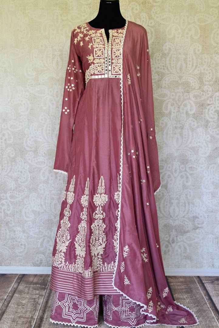 Buy onion pink mirror and hand embroidery silk suit online in USA with palazzo. Make special occasions even more special with your captivating traditional style in designer salwar suits from Pure Elegance Indian clothing in USA.-full view