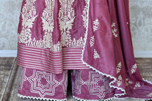 Buy onion pink mirror and hand embroidery silk suit online in USA with palazzo. Make special occasions even more special with your captivating traditional style in designer salwar suits from Pure Elegance Indian clothing in USA.-details