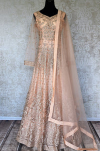Buy peach embroidered net Anarkali suit online in USA with dupatta. Relive tradition in Indian designer suits from Pure Elegance Indian clothing store in USA. Enhance your ethnic look with Indian dresses, Anarkali suits and Indowestern dresses available online.-full view