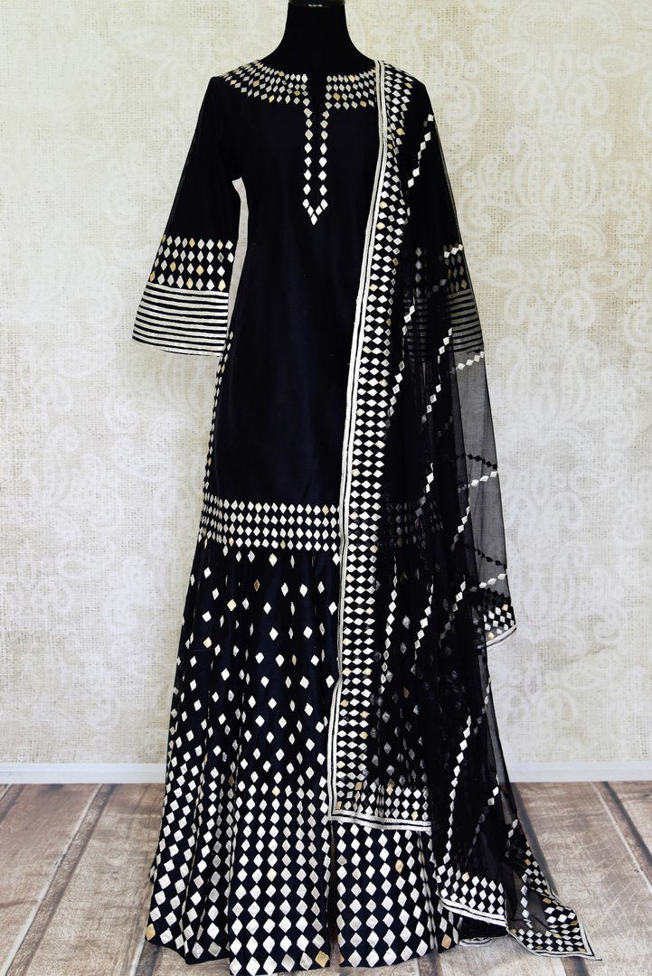 Buy ravishing black applique work silk sharara suit in USA with dupatta. Shine bright on weddings and special occasions with beautiful Indian dresses, designer lehengas from Pure Elegance Indian fashion store in USA.-full view