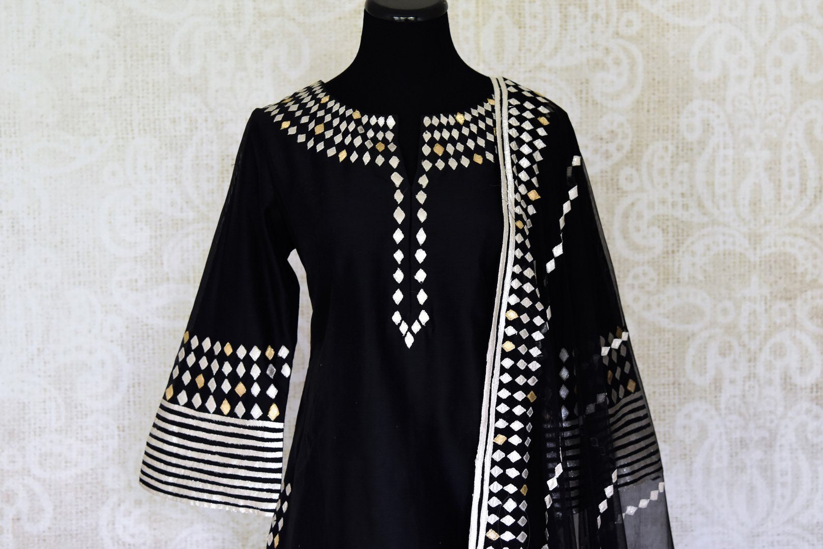 Buy ravishing black applique work silk sharara suit in USA with dupatta. Shine bright on weddings and special occasions with beautiful Indian dresses, designer lehengas from Pure Elegance Indian fashion store in USA.-front